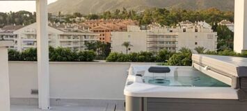 Luxury Beachside Penthouse with Rooftop Jacuzzi in Marbella